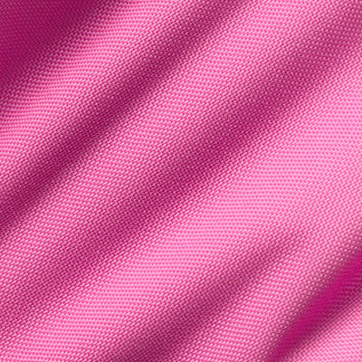 Close-up of the fabric texture in Playful Pink color used in the Nike Varsity Elite backpack.